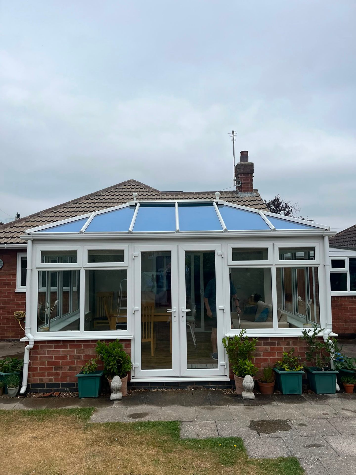 Clean conservatory with crystal-clear glass roof