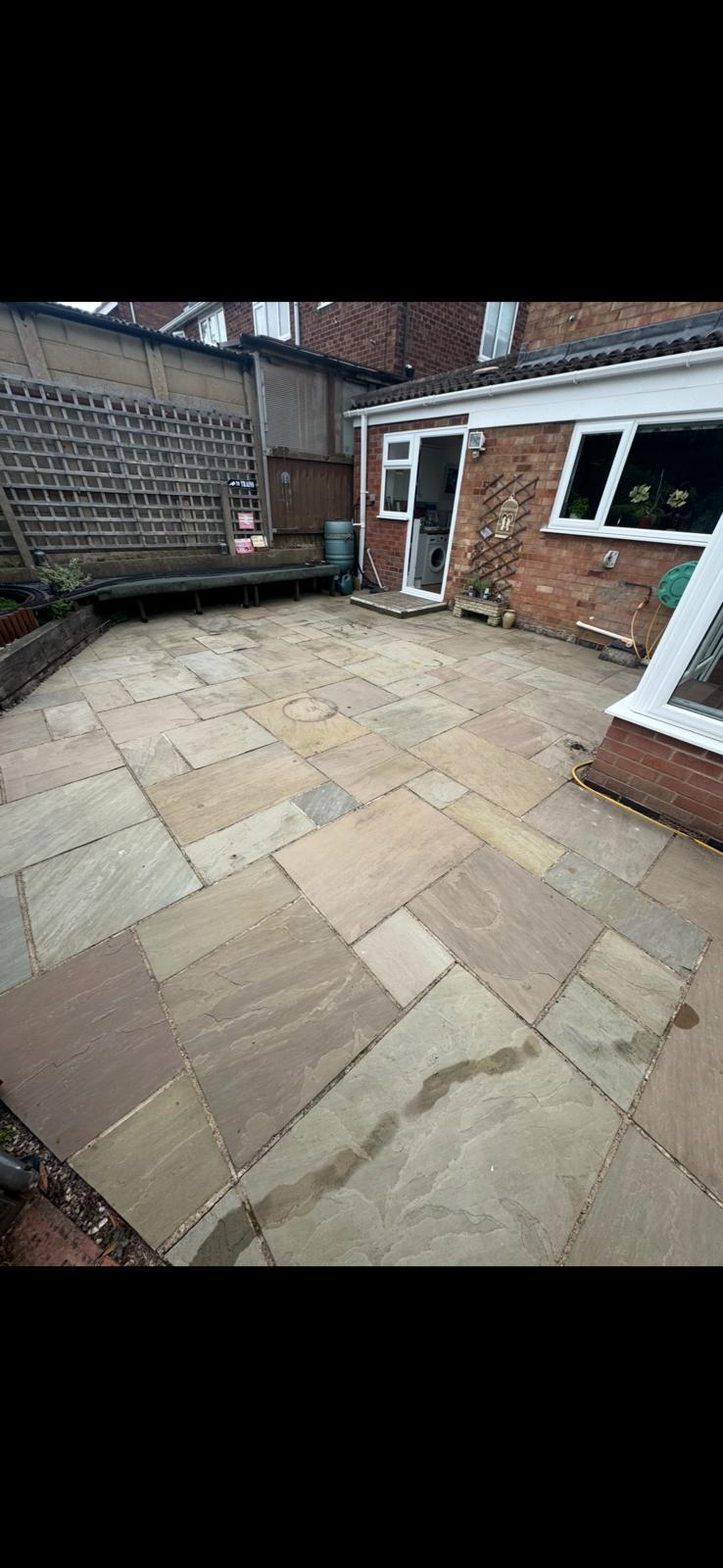 Sandstone rear patio — before